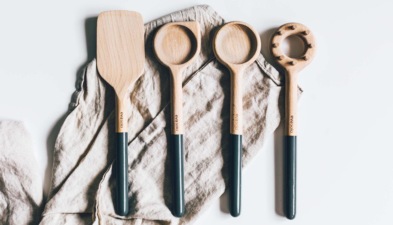 Eva Solo wooden spoon and utensil set on linen